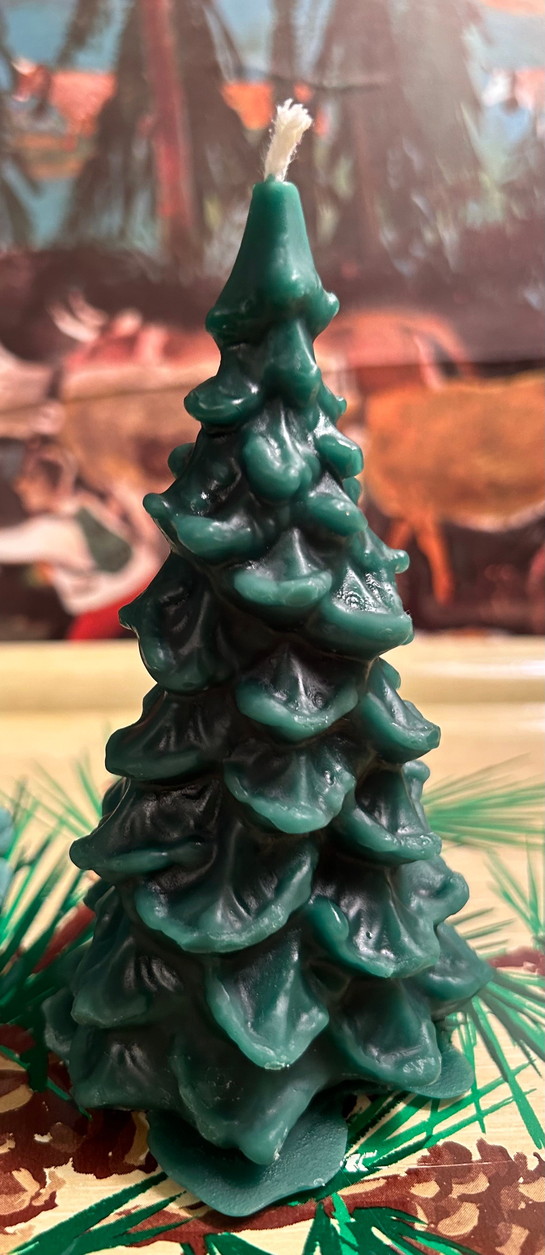 Christmas tree molded candle in dark green.  Five inches tall.